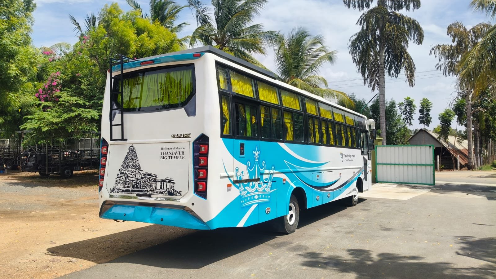 TK TRANS BUS luxury coach rear view with Thanjavur Big Temple graphic
