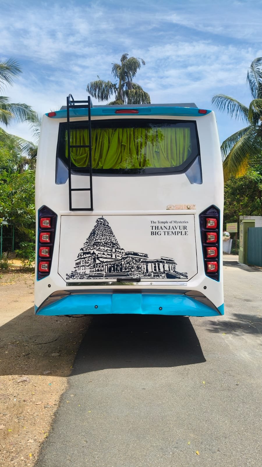 TK TRANS BUS coach rear view on the road